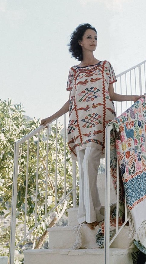 Gloria Guinness, in traditional Mexican dress, in her Acapulco home