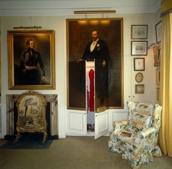 A large portrait of King Edward VII by Archibald Stuart Wortley cleverly disguises a pair of built-in wardrobe doors in the State Bedroom. Old Battersea House, London