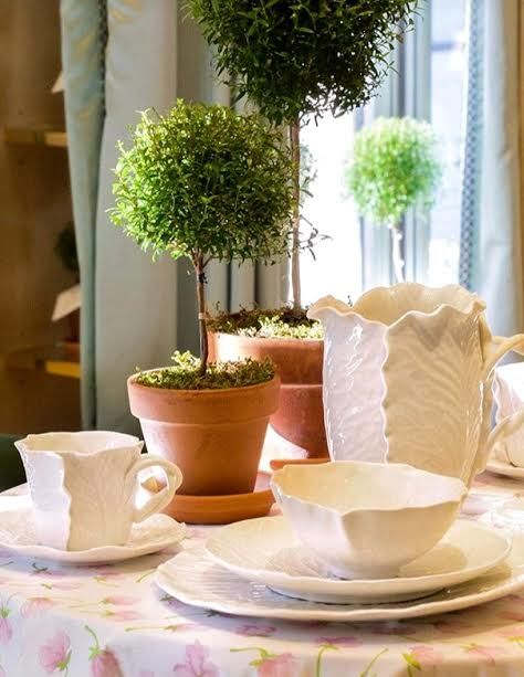 Topiaries are present in Tory's homes, stores and offices. Here are shown with Dodie Thayer for Tory Burch Dinnerware.