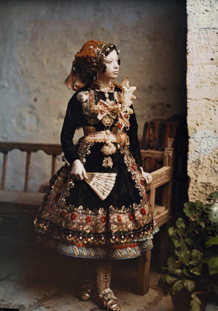 A girl from Lagartera wearing a traditional costume in 1914. Photography by Jules Gervais-Courtellemont for National Geographic