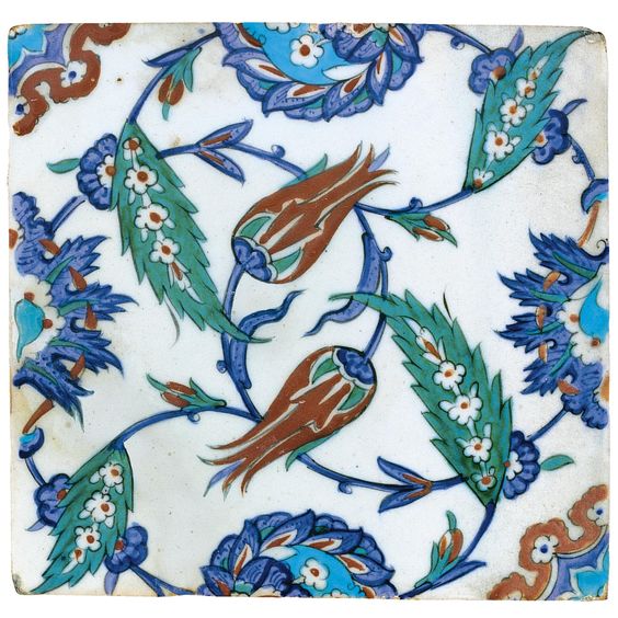 An Iznik Polychrome tile, Turkey, circa 1575 of square form painted in underglaze cobalt blue, viridian green, turquoise and relief red, outlined in black with tulips, saz and composite lotus and saz palmettes issuing from scrolling tendrils. Sotheby's
