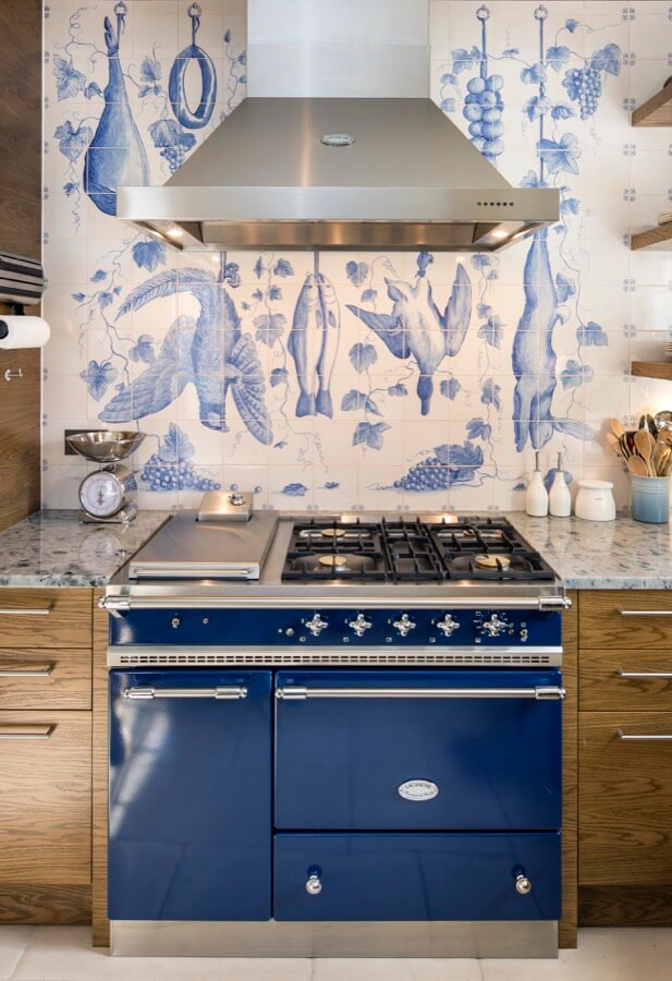 The hand-painted tiles in this London kitchen were commissioned especially for this room with a design that was worked up over months to meet with the client's brief. The hand-painted tiles in this London kitchen were commissioned especially for this room with a design that was worked up over months to meet with the client's brief.
