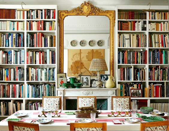 Carolina Irving's Paris dining room reveals her vast collection of reference materials, carefully organized for easy inspiration. By day, Carolina employs the space for research and work and in the evening it is home to frequent dinner parties. Jansen oak chairs are upholstered with her own Kandily pattern. Mileu Magazine