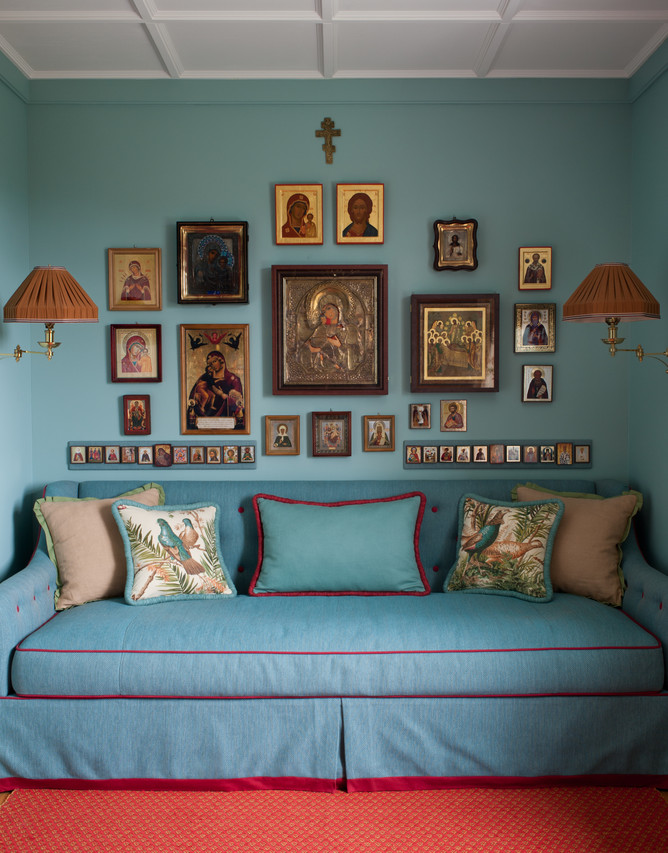 A storybook country house by Kirill Istomin. The client's collection of Russian icons is displayed in the daughter's study. The throw pillows are Lee Jofa and the cotton woven rug is from Vandra Rugs. WSJ