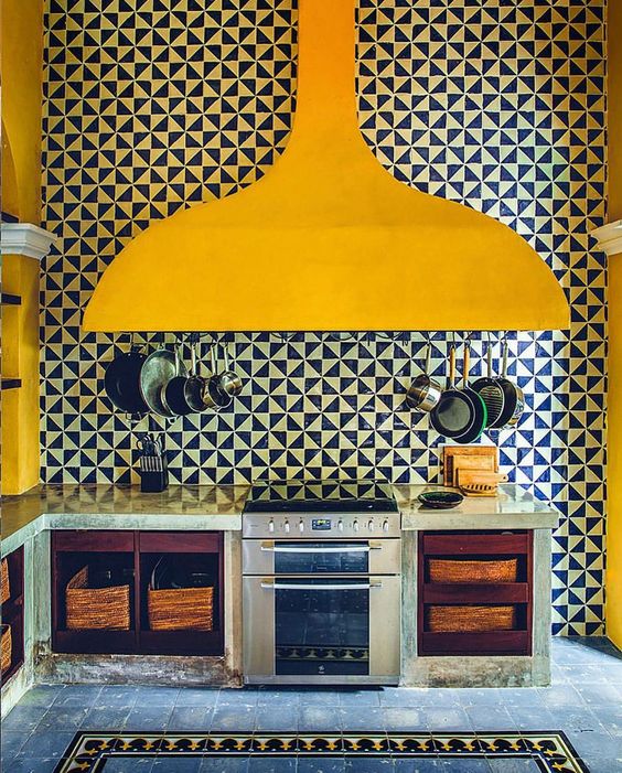 Bright Yellow on black and white tiles in this kitchen in Merida, Mexico, photographed by @matthieusalvaing for Cabana Issue