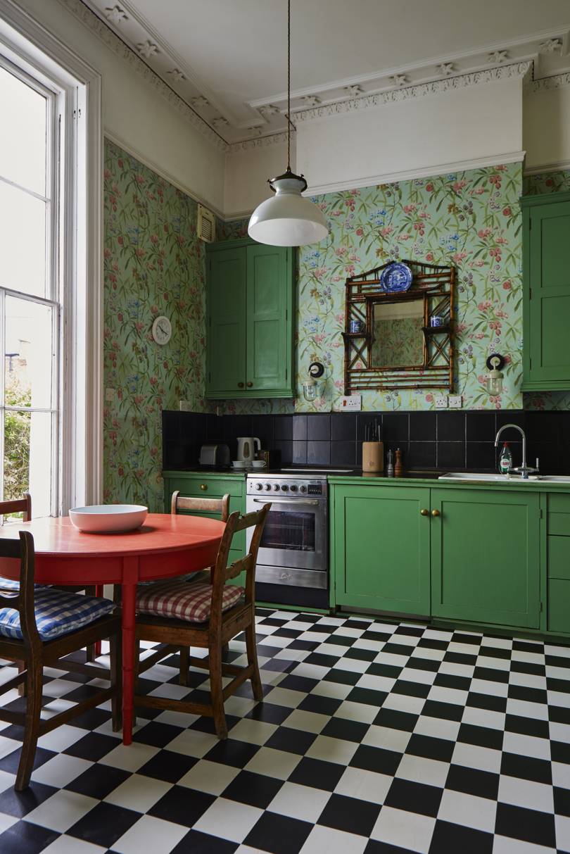 green kitchen with floral wallpaper featured in Ros Byam Shaw book Perfect English Townhouse