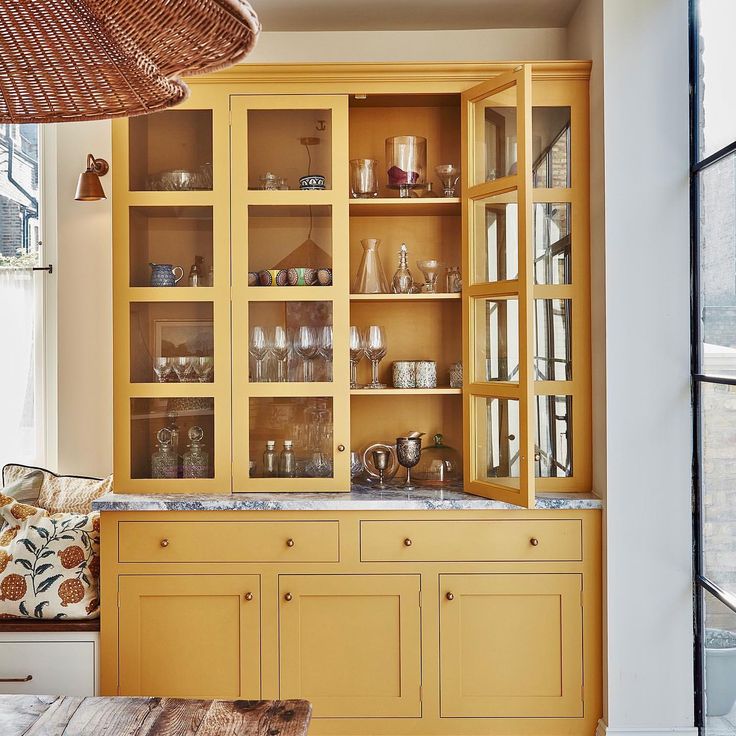 Sunny yellow bar cabinet painted in Farrow and Ball India Yellow by Polly Ashman https://www.pollyashman.com/